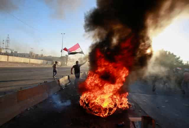 Iraqi authorities lift Baghdad curfew; death toll rises to 72 in days of unrest