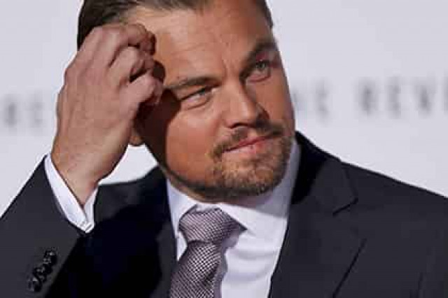 Ди Каприо купил гитару Боно за 100 тысяч долларов
