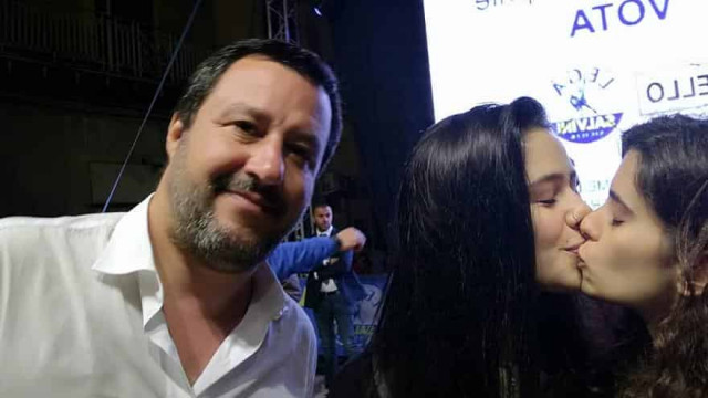 Kissing girls photobomb Salvini in protest over anti-LGBT conference
