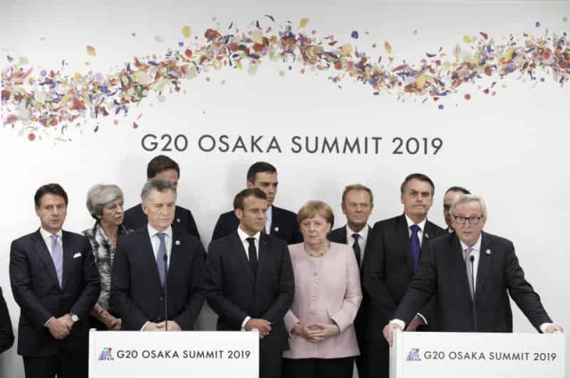 The Latest: Putin says election issue was raised with Trump