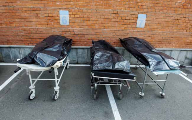 Тела еще 20 убитых мирных жителей обнаружили в Киевской области, - полиция
